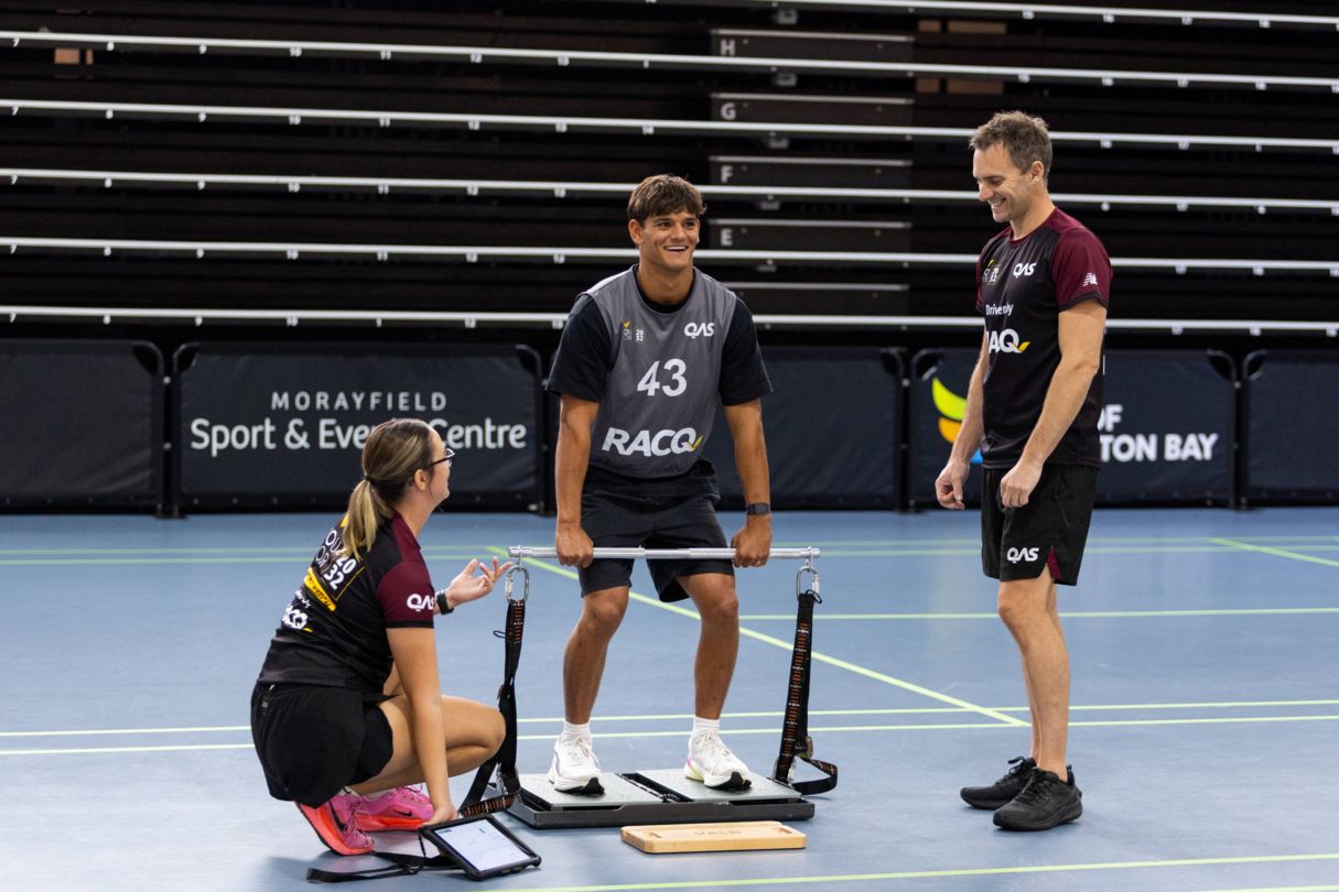 Young male athlete with talent team testing his strength with a mid-thigh pulling task