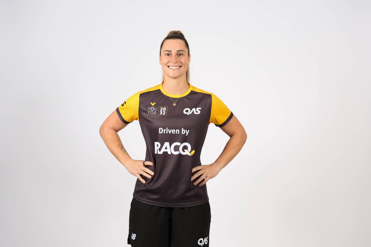 Natalya Diehm, YouFor2032 Talent Search program ambassador, wears a yellow and grey YouFor2032, driven by RACQ, branded jersey in a headshot style image.