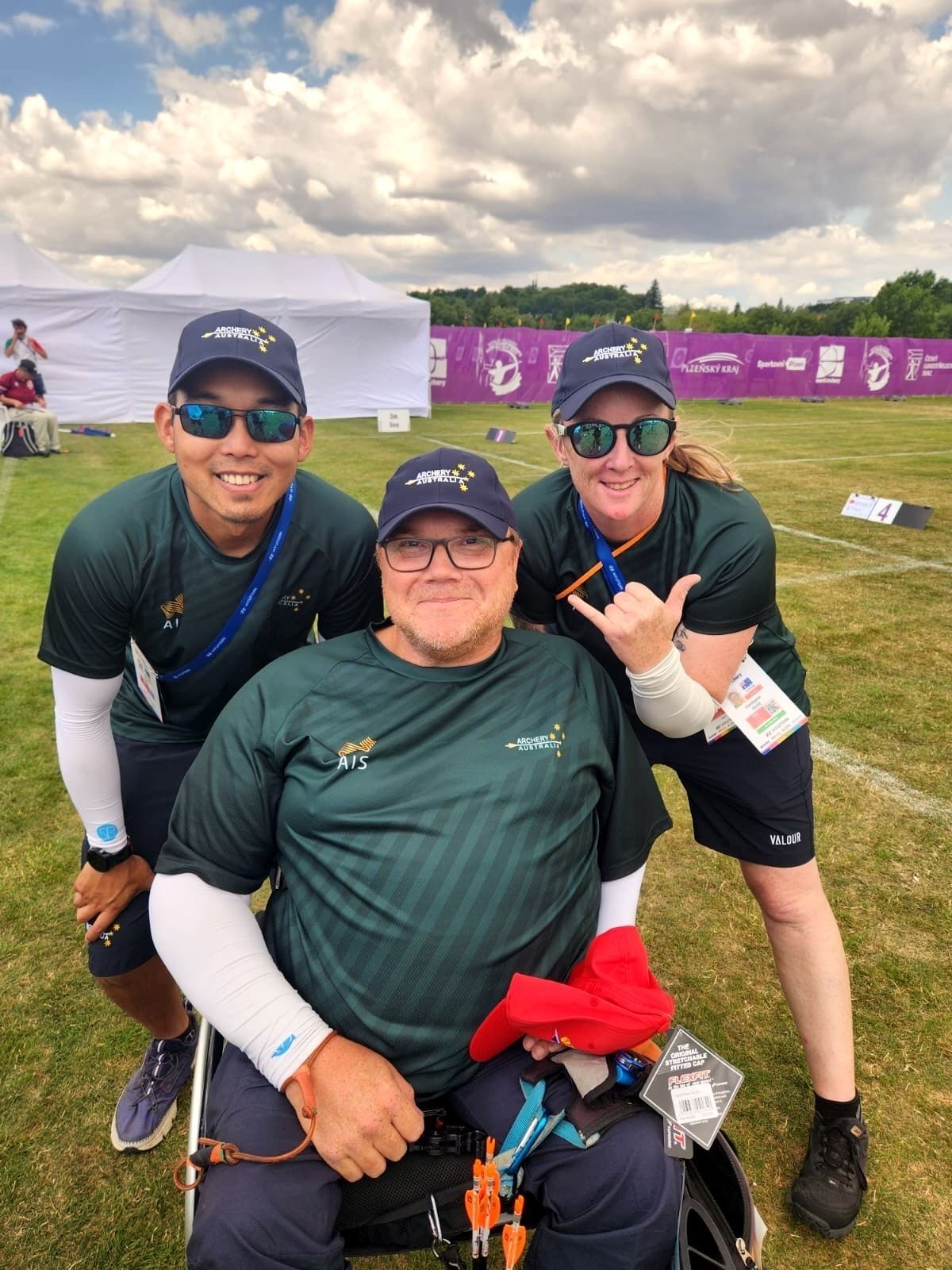 Chris David Para Archery athlete with his support team from QAS, AIS and Archery Australia