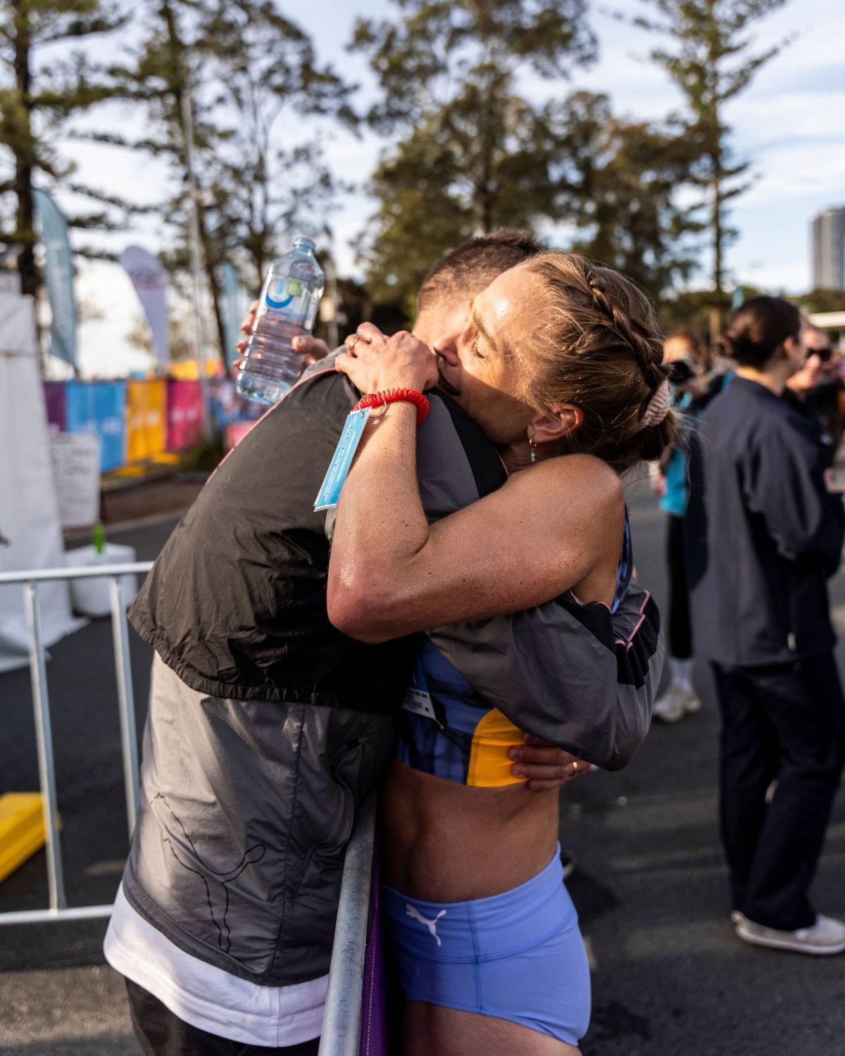Genevieve Gregson's husband, Ryan, celebrating with Genevieve Gregson post-race