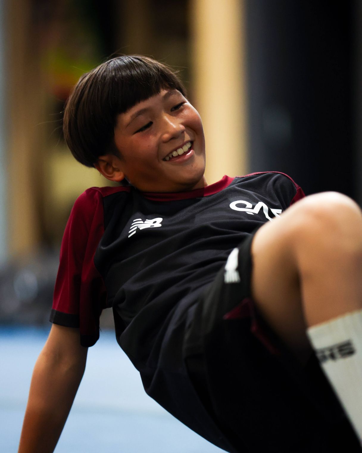 Young athlete on mat smiling