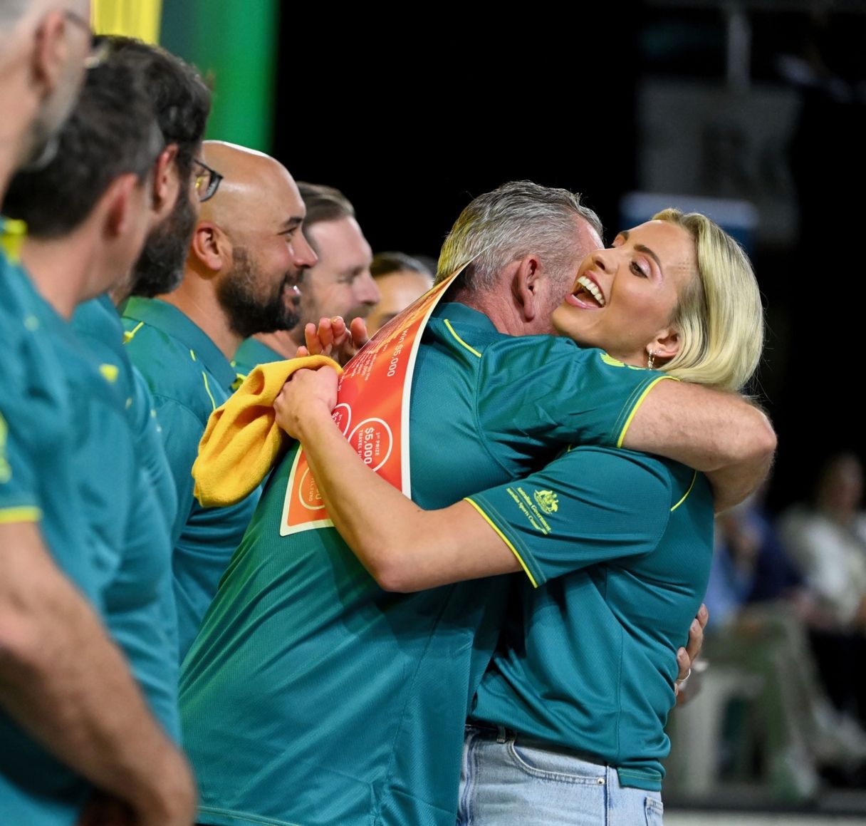 Alexa Leary hugging her coach, Jon Bell, at the Brisbane Aquatic Centre after her selection for the 2024 Paris Paralympic Games.