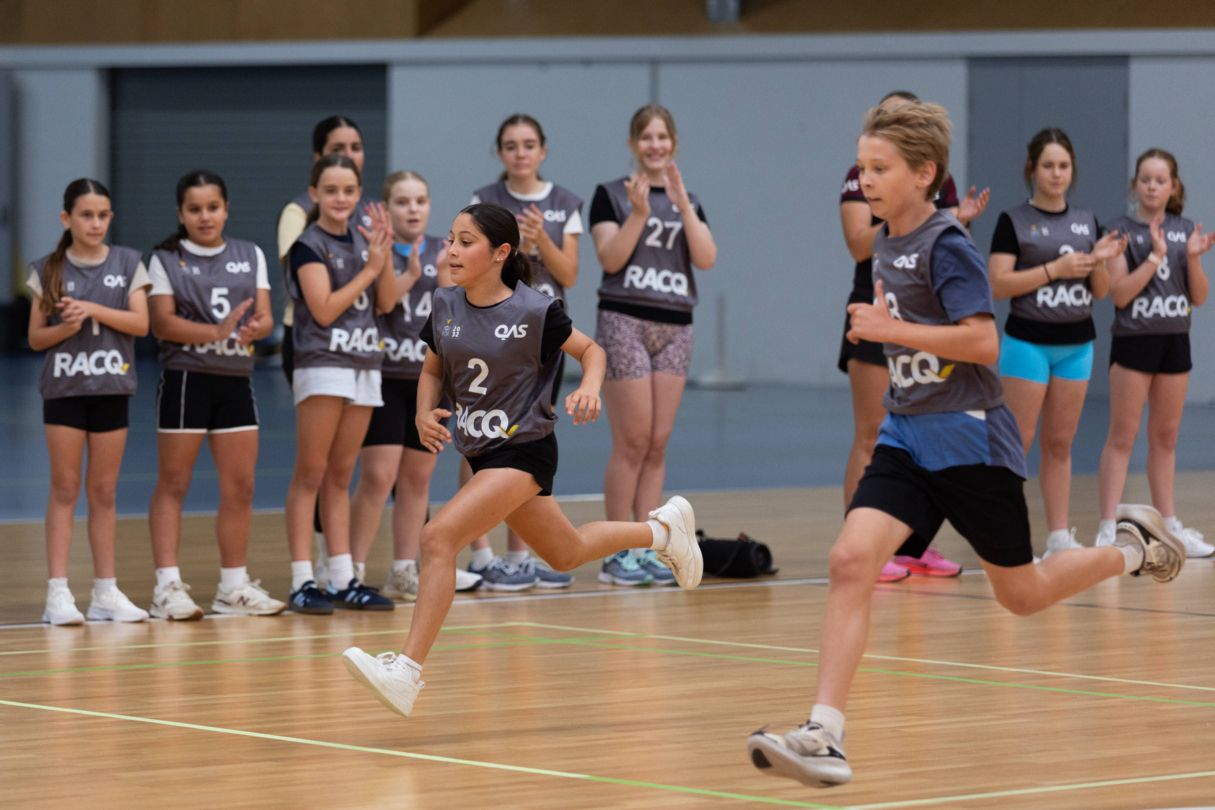 Two athletes running to test their speed at a YouFor2032 Talent Search testing day.