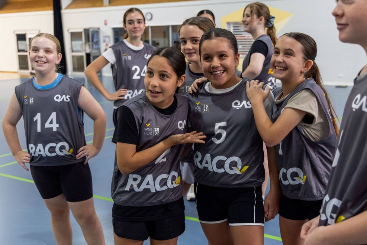 A group of young girls together smiling at a YouFor2032 talent Search event.
