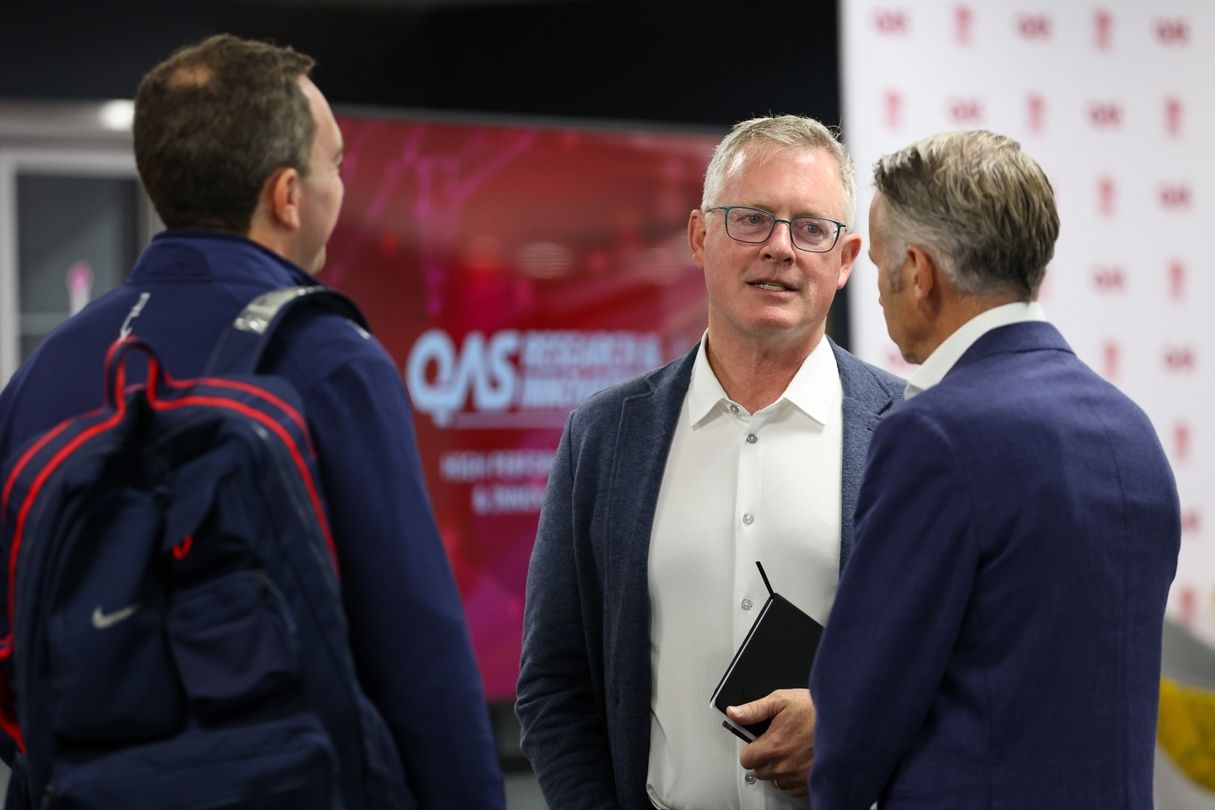 Attendees networking at the QAS Research & Innovation Summit