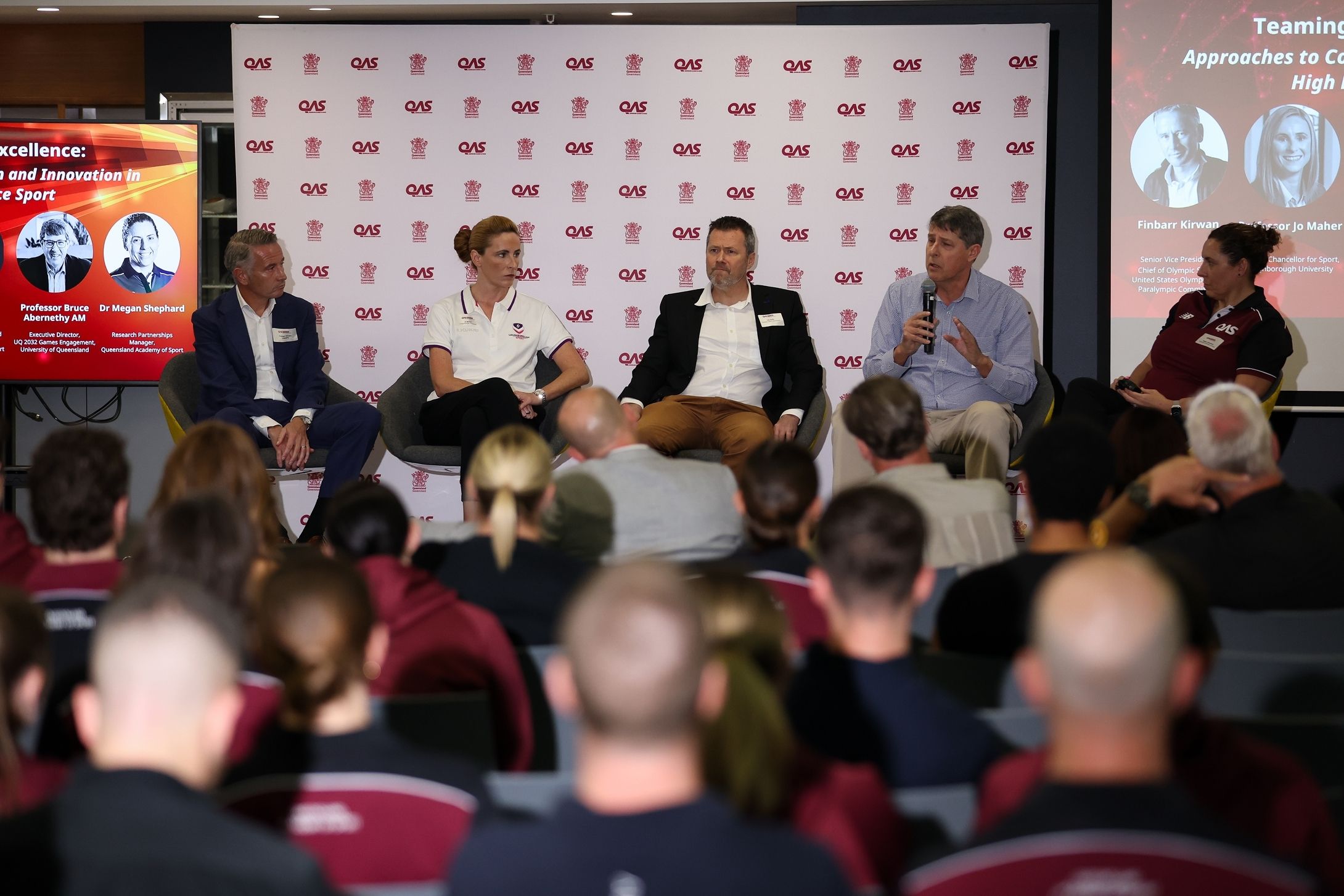 QAS Research & Innovation Summit panel speakers participating in a discussion on high performance sport research and innovation